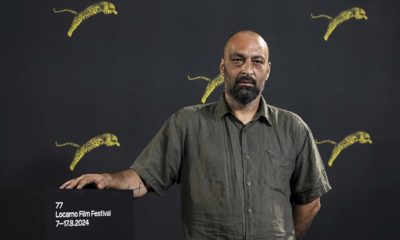 Ala Eddine Slim, réalisateur tunisien, pose lors d'un photocall pour le film « Agora » au 77e Festival international du film de Locarno, à Locarno, en Suisse, mercredi 14 août 2024. (Jean-Christophe Bott/Keystone via AP)